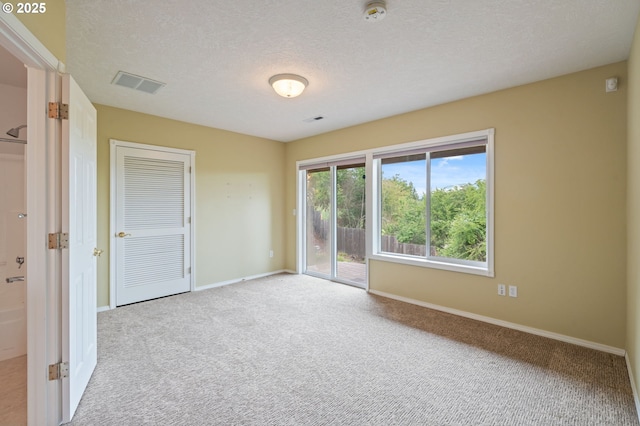15745 SE Bybee Dr, Portland, OR 97236 - carpeted spare room with a smoke detector, baseboards, and a textured ceiling