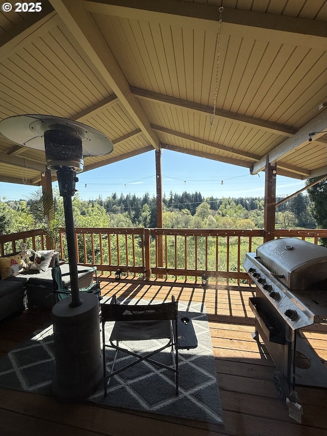 wooden terrace featuring area for grilling