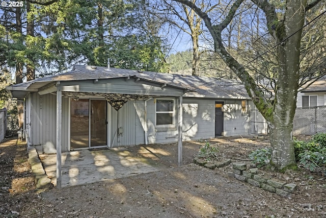 rear view of house featuring a patio