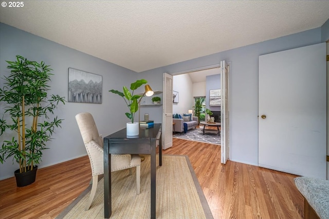 12960 SW 5th St, Beaverton, OR 97005 - dining area with light wood-style flooring and a textured ceiling