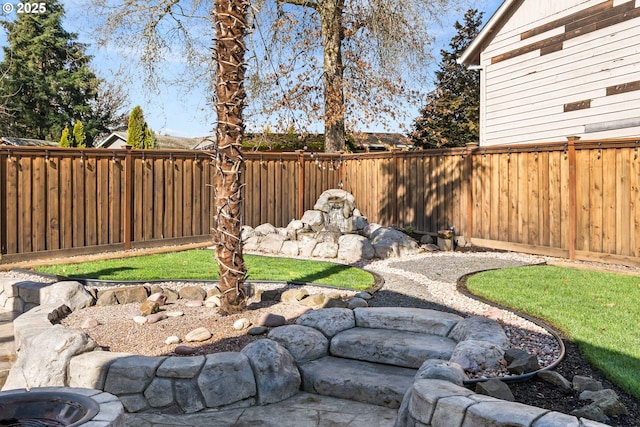 view of yard with a fenced backyard