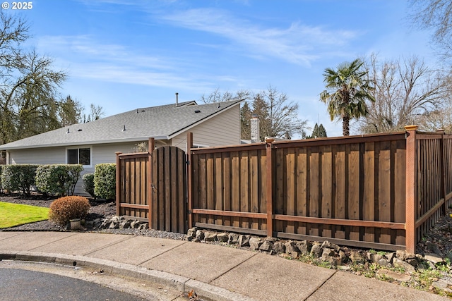 view of gate featuring fence