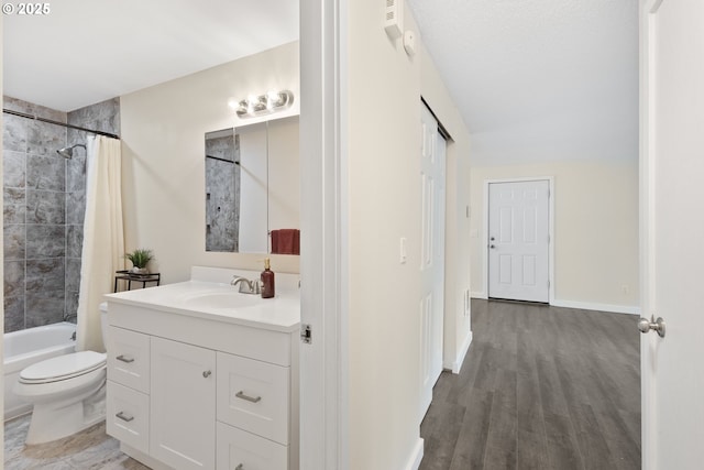 16825 SE Powell Blvd, Portland, OR 97236 - full bathroom with toilet, vanity, shower / tub combo, wood finished floors, and baseboards