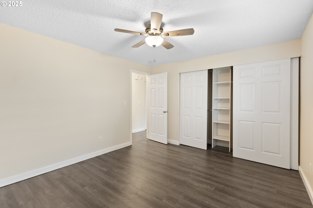 16825 SE Powell Blvd, Portland, OR 97236 - unfurnished bedroom featuring dark wood-style flooring, baseboards, a closet, ceiling fan, and a textured ceiling