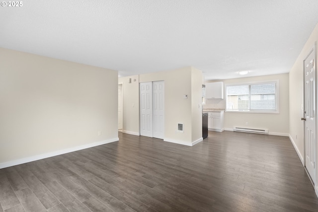 16825 SE Powell Blvd, Portland, OR 97236 - unfurnished living room featuring a baseboard radiator, dark wood-type flooring, and baseboards