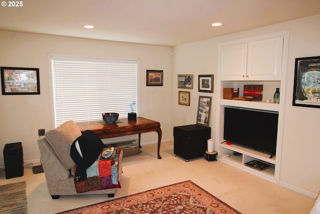 carpeted home office featuring built in shelves