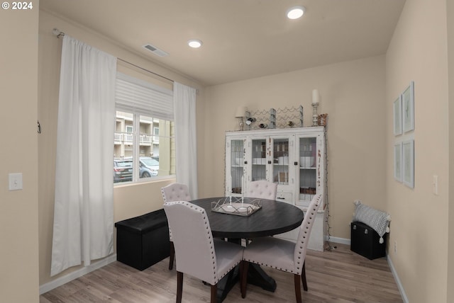 dining room with light hardwood / wood-style floors