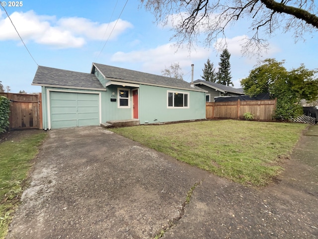 ranch-style house featuring a garage and a front lawn