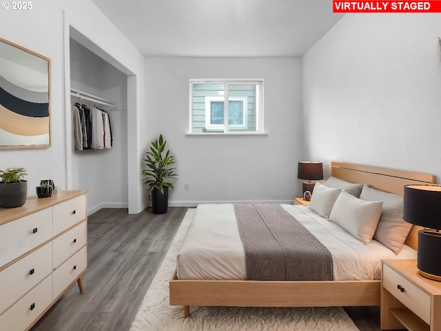 bedroom with a closet and light hardwood / wood-style flooring