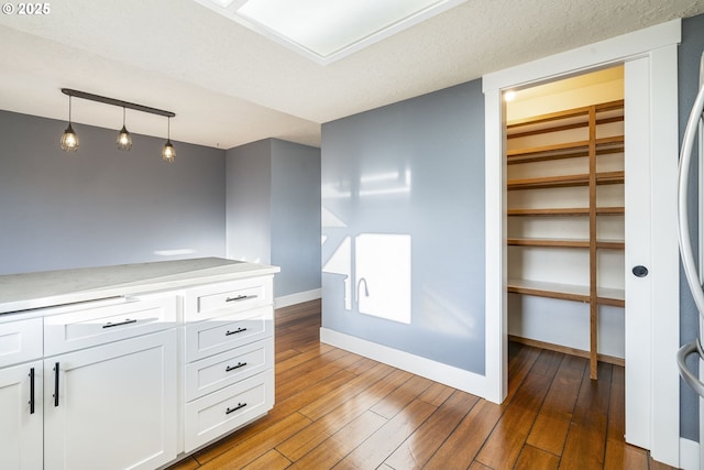 5219 Spring Leaf Ct N, Keizer, OR 97303 - bar featuring hardwood / wood-style flooring and hanging light fixtures