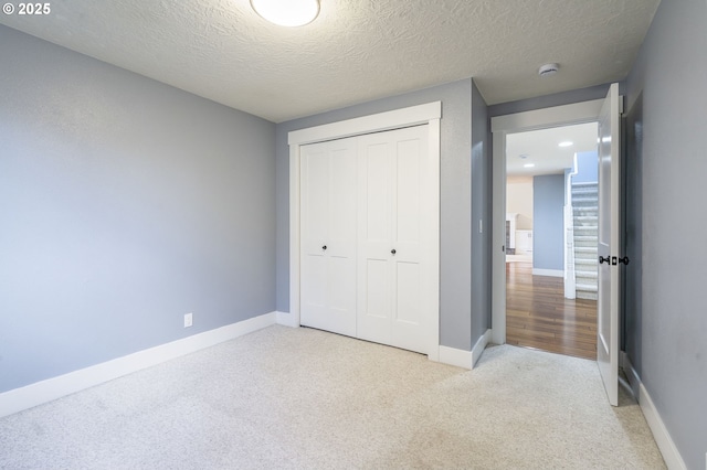 5219 Spring Leaf Ct N, Keizer, OR 97303 - unfurnished bedroom featuring carpet flooring, a closet, and a textured ceiling