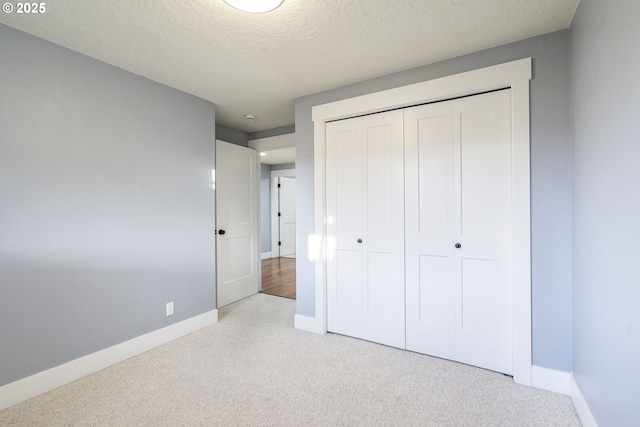 5219 Spring Leaf Ct N, Keizer, OR 97303 - unfurnished bedroom featuring carpet floors, a closet, and a textured ceiling