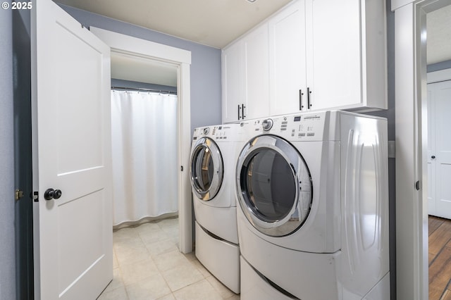 5219 Spring Leaf Ct N, Keizer, OR 97303 - laundry area featuring independent washer and dryer and cabinet space