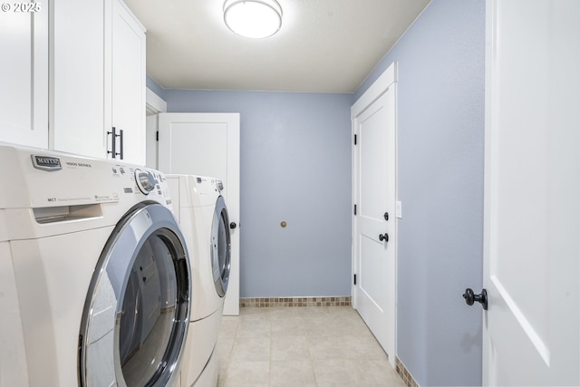 5219 Spring Leaf Ct N, Keizer, OR 97303 - washroom with washing machine and dryer, cabinet space, and light tile patterned floors