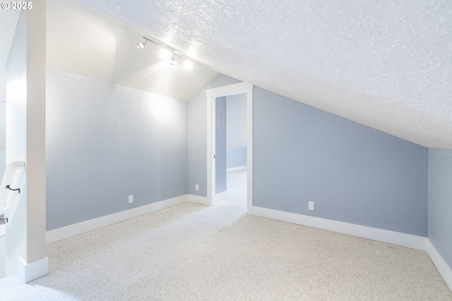 5219 Spring Leaf Ct N, Keizer, OR 97303 - bonus room featuring a textured ceiling, carpet flooring, and vaulted ceiling