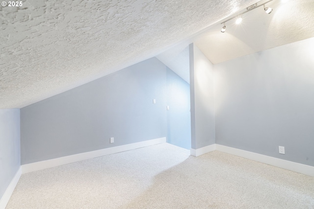 5219 Spring Leaf Ct N, Keizer, OR 97303 - additional living space featuring carpet floors, vaulted ceiling, and a textured ceiling