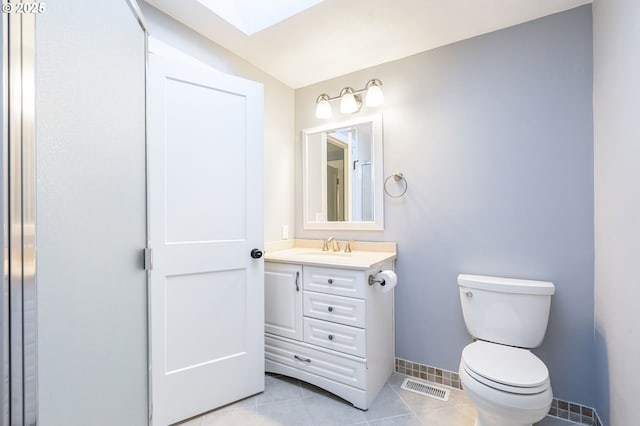 5219 Spring Leaf Ct N, Keizer, OR 97303 - bathroom with vanity, a skylight, and tile patterned floors