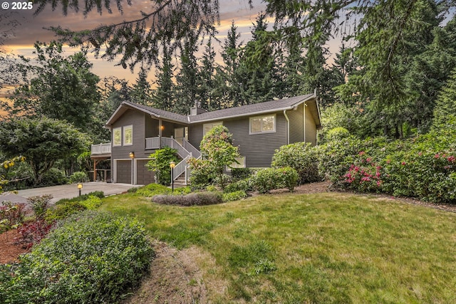 20681 S Wisteria Rd, West Linn, OR 97068 - view of front of home with an attached garage, stairs, a lawn, a chimney, and concrete driveway
