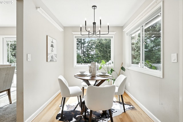 20681 S Wisteria Rd, West Linn, OR 97068 - dining area with a chandelier, healthy amount of natural light, and light wood-type flooring