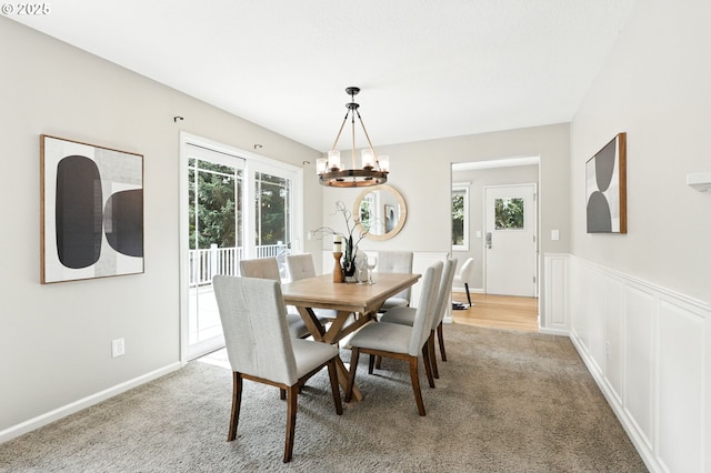 20681 S Wisteria Rd, West Linn, OR 97068 - dining room with a chandelier, light colored carpet, and a wainscoted wall