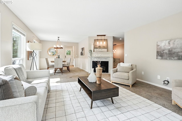 20681 S Wisteria Rd, West Linn, OR 97068 - living room with a chandelier, light colored carpet, and a high end fireplace