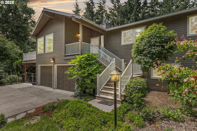 20681 S Wisteria Rd, West Linn, OR 97068 - view of front of house with an attached garage, driveway, and stairway