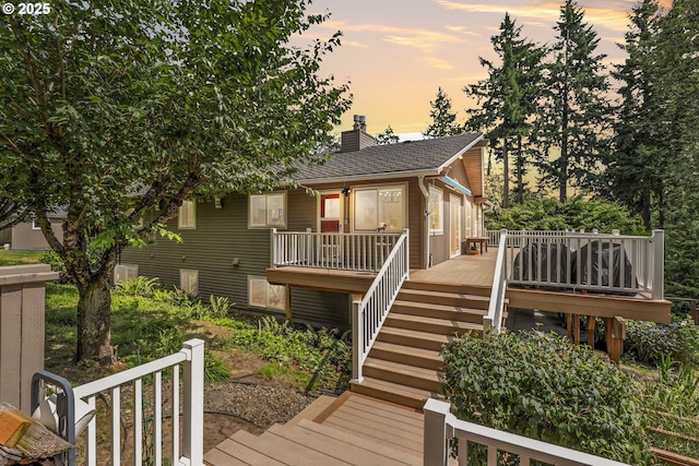 20681 S Wisteria Rd, West Linn, OR 97068 - view of front of property featuring stairway, a wooden deck, a chimney, and roof with shingles