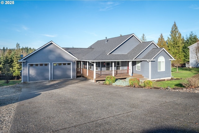 view of front of home featuring a garage and a porch