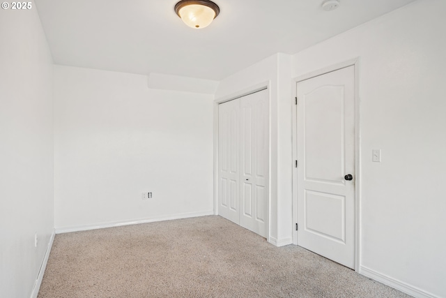 unfurnished bedroom with light carpet