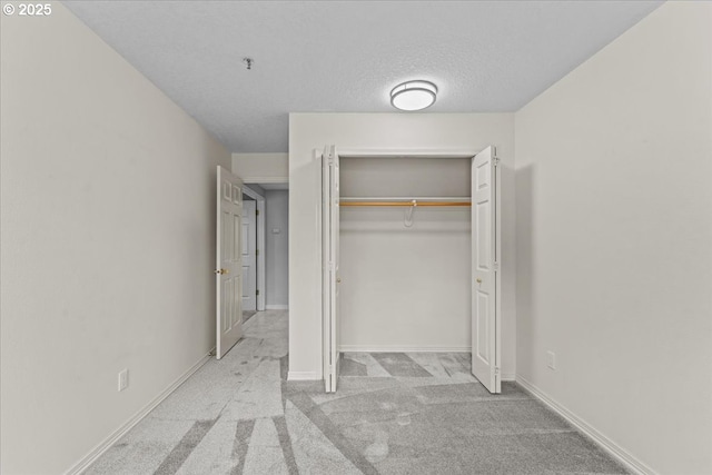 15420 NE Knott St Unit 2, Portland, OR 97230 - unfurnished bedroom featuring carpet, a closet, baseboards, and a textured ceiling