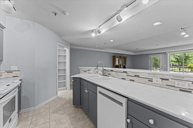 15420 NE Knott St Unit 2, Portland, OR 97230 - kitchen featuring white appliances, a sink, gray cabinetry, track lighting, and a textured ceiling