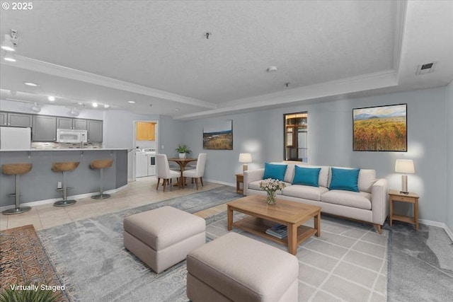 15420 NE Knott St Unit 2, Portland, OR 97230 - living room with a raised ceiling, baseboards, ornamental molding, a textured ceiling, and recessed lighting