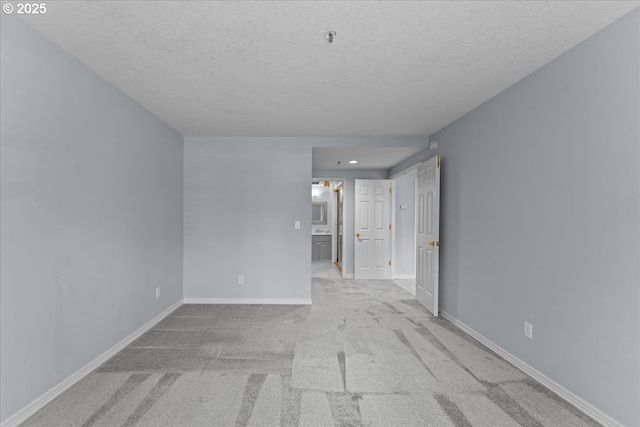 15420 NE Knott St Unit 2, Portland, OR 97230 - unfurnished room featuring a textured ceiling, carpet flooring, baseboards, a pendent fire sprinkler, and recessed lighting