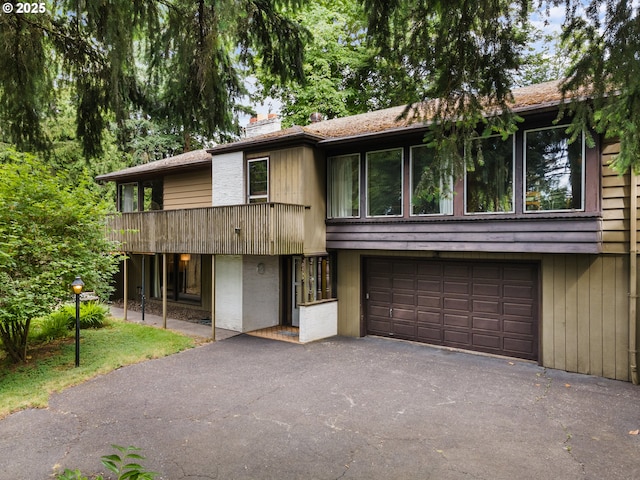 6455 SW Scholls Ferry Rd, Portland, OR 97223 - view of property featuring driveway, a chimney, and an attached garage