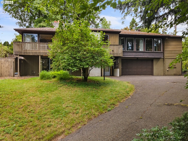 6455 SW Scholls Ferry Rd, Portland, OR 97223 - multi unit property featuring asphalt driveway, a garage, a front yard, a balcony, and a chimney