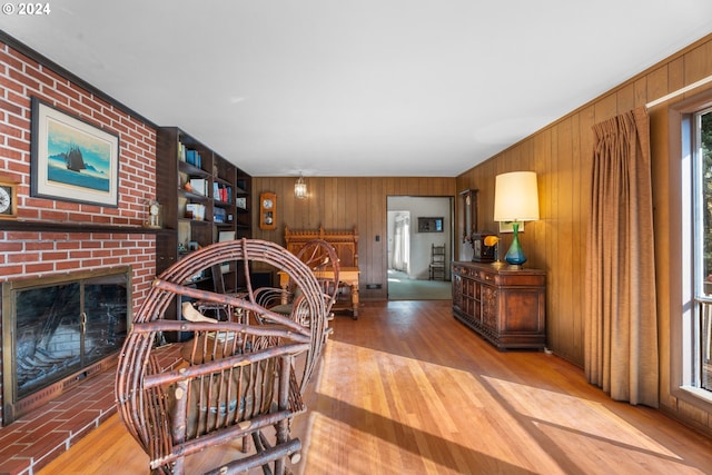 6455 SW Scholls Ferry Rd, Portland, OR 97223 - living area featuring wood walls, wood finished floors, and a brick fireplace