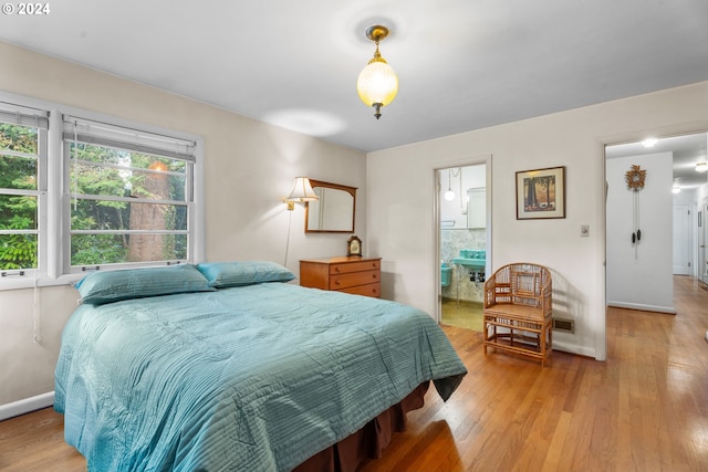 6455 SW Scholls Ferry Rd, Portland, OR 97223 - bedroom featuring light wood-type flooring and baseboards