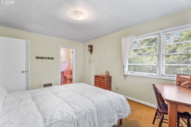 6455 SW Scholls Ferry Rd, Portland, OR 97223 - carpeted bedroom featuring baseboards and ensuite bath
