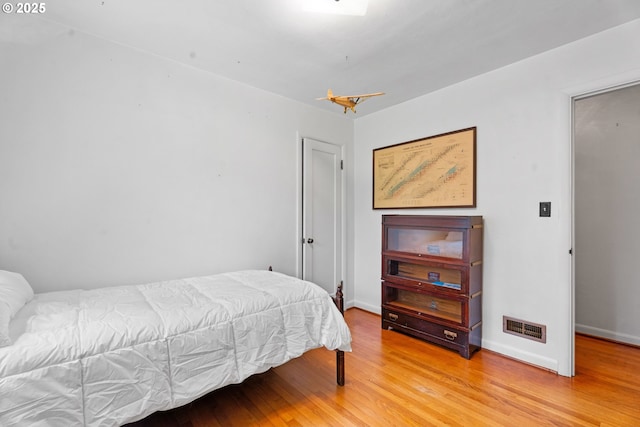 6455 SW Scholls Ferry Rd, Portland, OR 97223 - bedroom featuring light wood-style flooring and baseboards