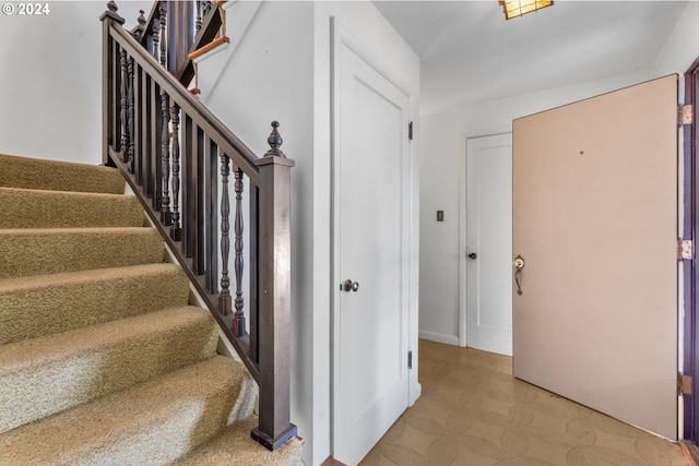 6455 SW Scholls Ferry Rd, Portland, OR 97223 - staircase with tile patterned floors and baseboards