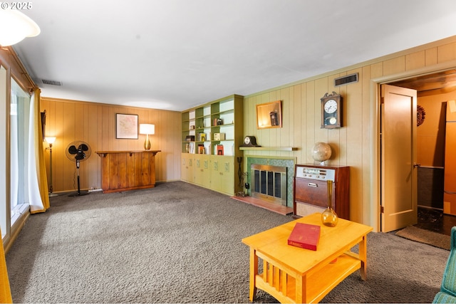 6455 SW Scholls Ferry Rd, Portland, OR 97223 - living area featuring wooden walls, carpet floors, and a fireplace with flush hearth