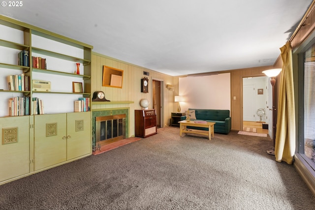 6455 SW Scholls Ferry Rd, Portland, OR 97223 - living room featuring carpet flooring, a fireplace with flush hearth, and wood walls