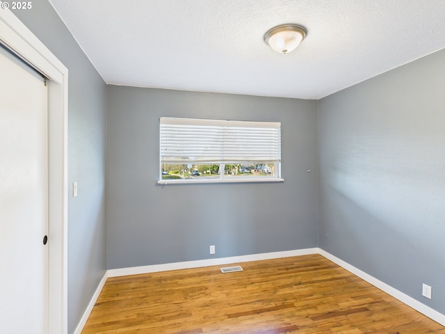 415 NE 99th St, Vancouver, WA 98665 - unfurnished room featuring wood finished floors and baseboards