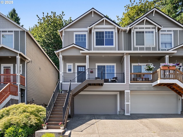 13143 SW Brianne Way, Portland, OR 97223 - view of front facade with stairway, concrete driveway, board and batten siding, and an attached garage