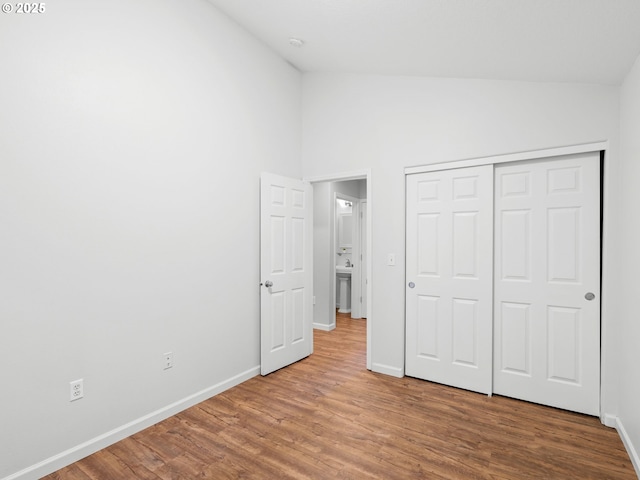 13143 SW Brianne Way, Portland, OR 97223 - unfurnished bedroom with wood finished floors, high vaulted ceiling, and a closet