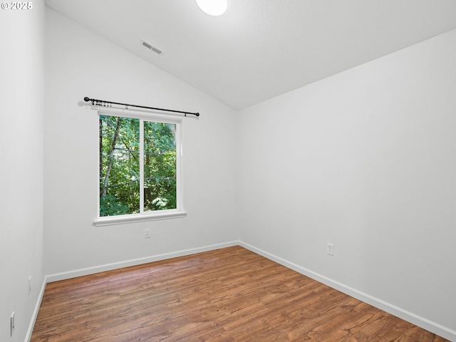 13143 SW Brianne Way, Portland, OR 97223 - spare room featuring vaulted ceiling and wood finished floors