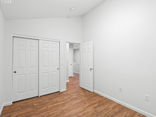 13143 SW Brianne Way, Portland, OR 97223 - unfurnished bedroom featuring wood finished floors, a closet, and high vaulted ceiling