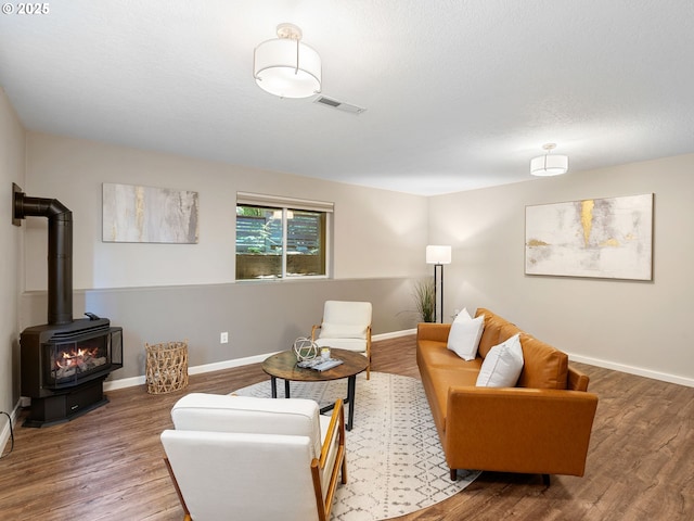 13143 SW Brianne Way, Portland, OR 97223 - living room with wood finished floors and a wood stove