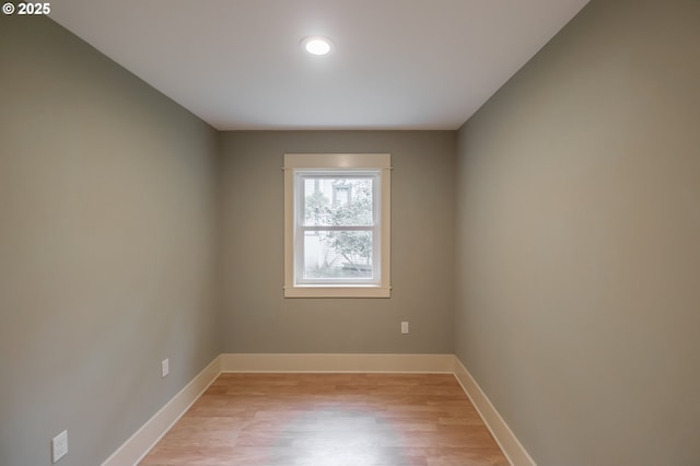 empty room featuring light wood-style floors and baseboards