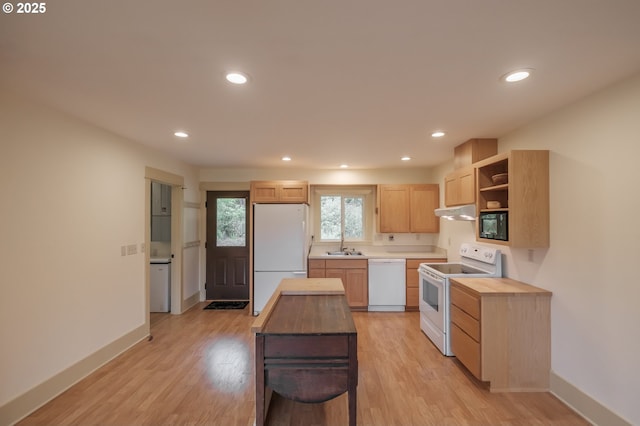 kitchen featuring white appliances, open shelves, a sink, light wood-type flooring, and recessed lighting